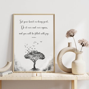 May include: A black and white printable wall art print with a quote by Buddha: "Set your heart on doing good. Do it over and over again, and you will be filled with joy." The quote is accompanied by a watercolor illustration of a tree with birds flying away from it.