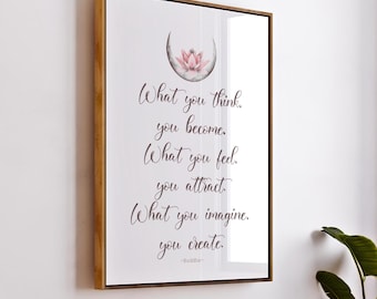 May include: A framed print with a watercolor illustration of a pink lotus flower and a crescent moon. The print features a quote by Buddha: "What you think, you become. What you feel, you attract. What you imagine, you create."