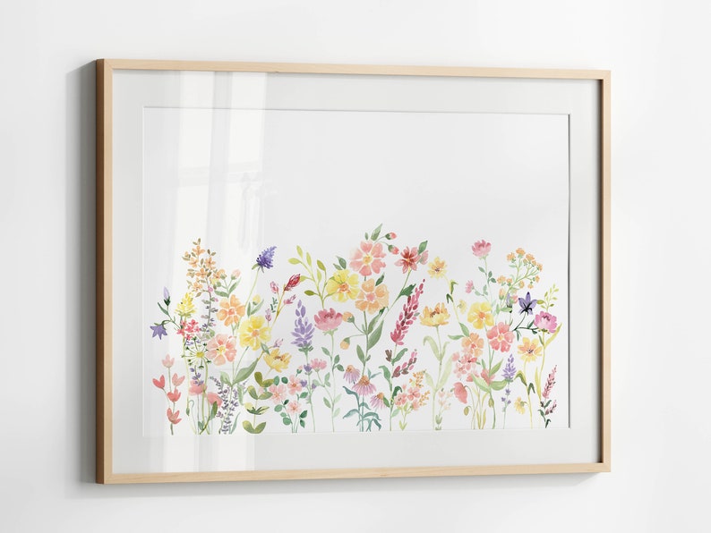 May include: A framed watercolor painting of a field of wildflowers in shades of pink, yellow, and purple. The flowers are arranged in a horizontal row across the bottom of the painting.