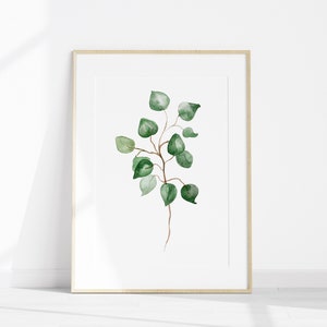 May include: A framed watercolor painting of a green leafy branch with a white background.