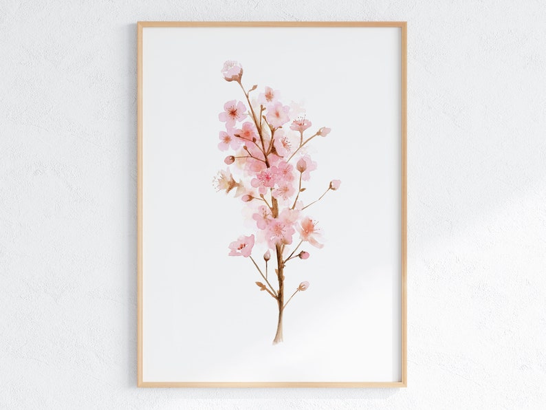 May include: A watercolor painting of a pink cherry blossom branch with delicate pink flowers and brown stems. The painting is framed in a light wood frame.