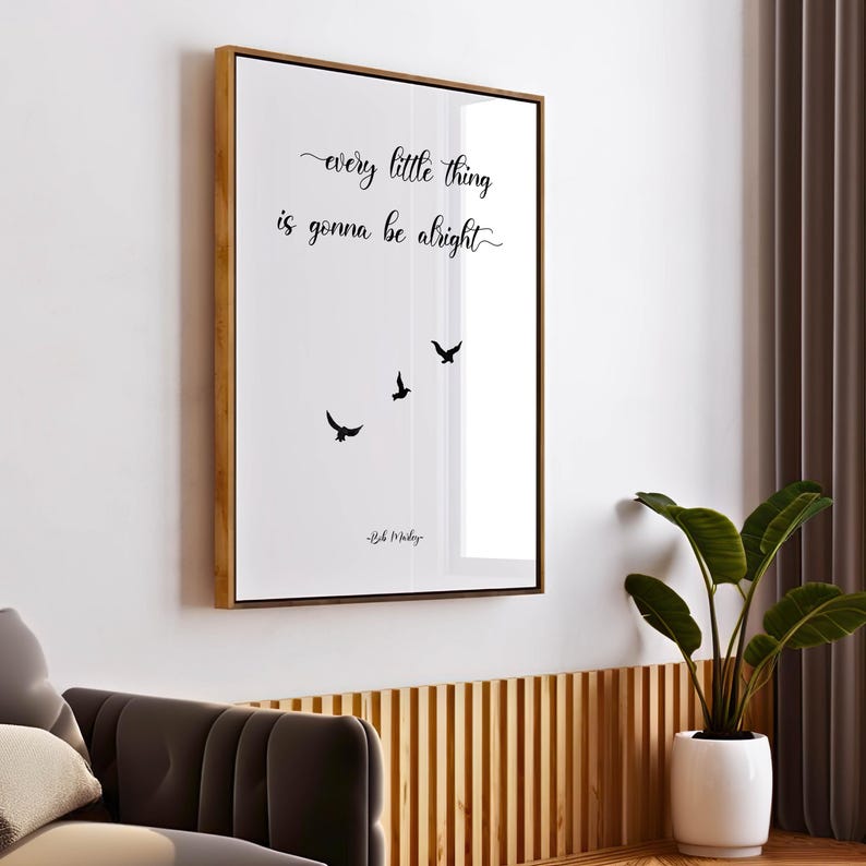 May include: A framed wall art print with the quote "every little thing is gonna be alright" in black script, with three black bird silhouettes. The frame is gold, and the artwork is displayed on a white background.