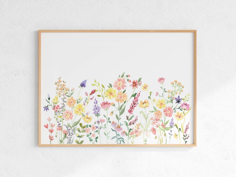 May include: A watercolor painting of a field of wildflowers in shades of pink, yellow, and purple. The flowers are arranged in a horizontal row across the bottom of the image, with a white background.