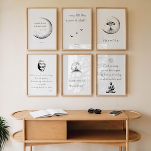 May include: Six framed art prints with inspirational quotes and illustrations. The prints feature black and white designs with quotes like "Every little thing is gonna be alright" and images of a moon, birds, and a meditating figure.