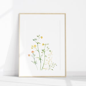 May include: A framed watercolor print of delicate yellow and orange wildflowers with green stems on a white background.