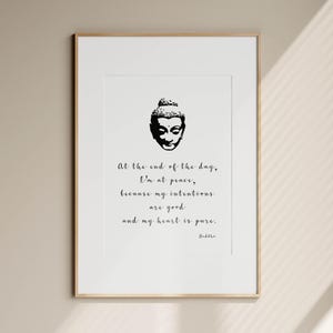May include: A framed print featuring a black and white illustration of a Buddha head. The print includes the quote, "At the end of the day, I'm at peace, because my intentions are good and my heart is pure." The word "Buddha" is at the bottom.