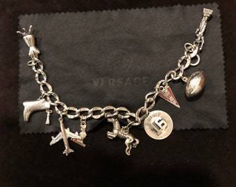 Sterling Silver(Most charms are stamped) some are not 81/2 inch Charm Bracelet