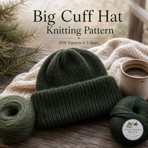 May include: A dark green knitted hat with a wide folded cuff, accompanied by two balls of matching green yarn, a cream-coloured knitted textile, and a ceramic mug. The text reads Big Cuff Hat Knitting Pattern, PDF Pattern, 5 Sizes.