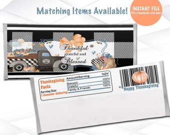 May include: A printable Thanksgiving-themed chocolate bar wrapper featuring a truck with pumpkins and a black and white checkered background. The text "Thankful grateful and Blessed" is featured on the wrapper. The wrapper also includes a nutrition facts label with the text "Thanksgiving Facts" and "Serving Size: 1 Awesome Gathering".