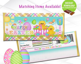 May include: Printable Easter chocolate bar wrapper featuring a yellow chick with a pink bow, a blue and green egg, and the text "Happy Easter". The wrapper is designed to fit a standard size chocolate bar.