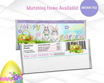 May include: A printable design for a chocolate bar wrapper featuring two bunnies with a basket of Easter eggs. The wrapper is decorated with pastel colors and flowers. The text on the wrapper reads "Happy Easter" and "May your Easter be egg-cellent".