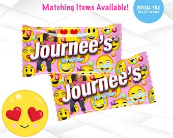 May include: Pink and yellow candy bag wrappers with a girl's photo and the text "Journee's 6th Birthday". The wrappers are decorated with emoji faces. The text "One Size Candies Natural & Artificial Flavors NET WT 2.17 OZ (61.5g)" is printed on the wrappers.