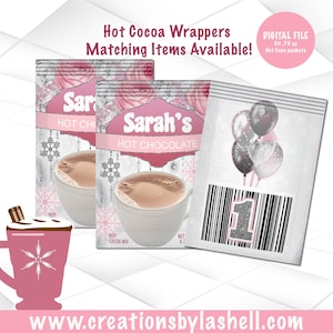May include: Two printable hot cocoa wrappers with a silver and pink snowflake design. The wrappers feature the name "Sarah's" and the text "Hot Chocolate". The wrappers are designed for 0.73 ounce hot cocoa packets.