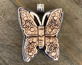 Bone carved butterfly pendant in Tibetan repousse silver, handcrafted, Nepalese, 45X32 mm