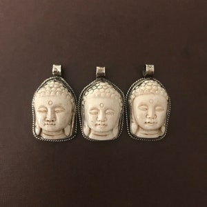 Buddha face carved bone pendant, handcrafted, Nepalese, Tibetan repousse silver