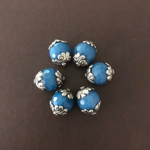 This listing is for 1 piece, faceted blue agate beads with floral caps, handcrafted, Nepalese, Himalayan