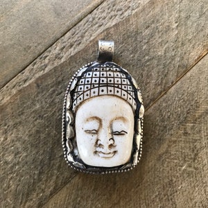 Buddha face carved bone pendant, handcrafted, Nepalese, Tibetan repousse silver, Himalayan, 55X34 mm