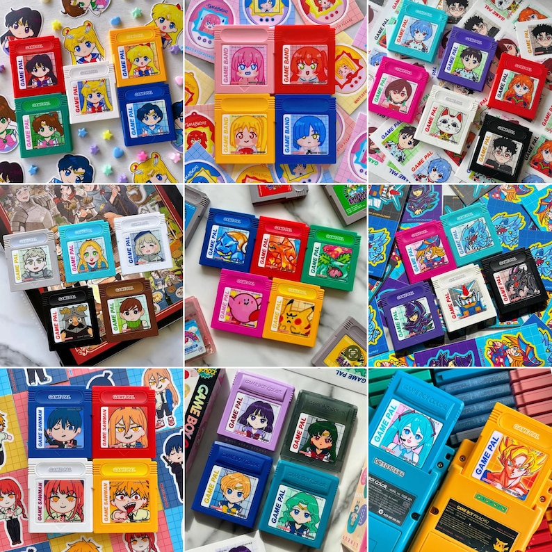 May include: A collection of colorful Game Boy cartridges featuring anime-style character art. The cartridges are in various colors, including red, yellow, blue, and green, with the text "GAME PAL" and "GAME BAND" visible. The artwork includes characters from popular anime series.