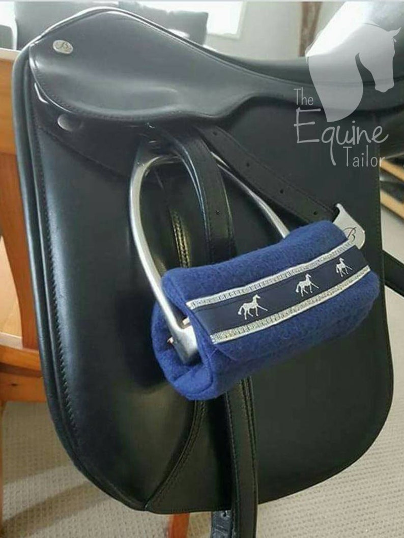 Aqua polar fleece with silver horse ribbon trim Stirrup Bumpers Stirrup covers.