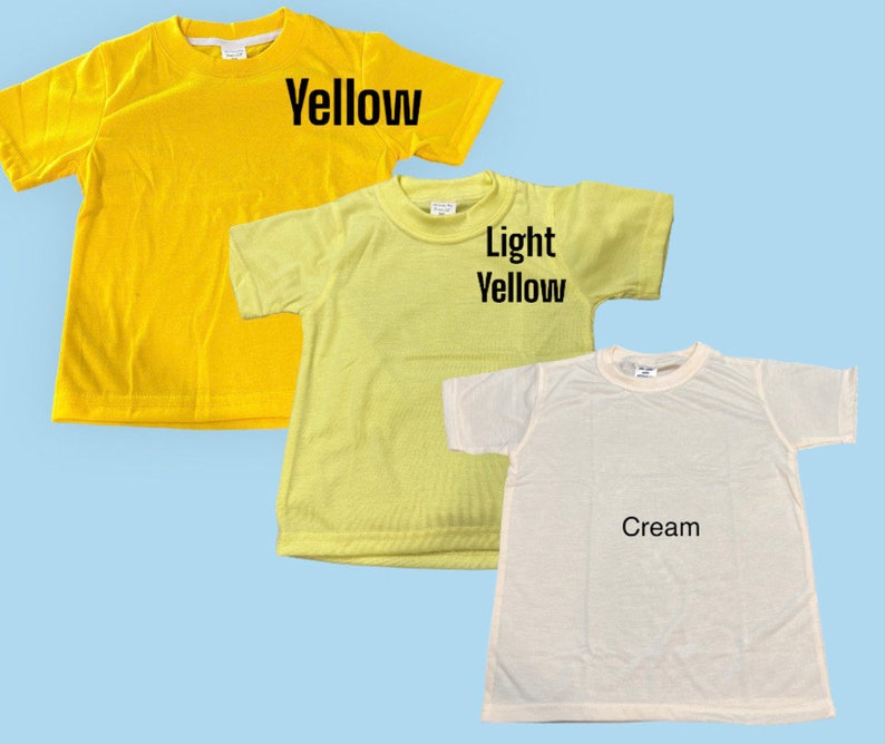 May include: Three plain t-shirts in different shades of yellow. The first is a bright yellow, the second is a light yellow, and the third is a cream color. Each shirt has a crew neck and short sleeves.