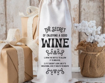 Puede incluir: Bolsa de botella de vino de algodón blanco con texto negro que dice "El secreto de disfrutar de un buen vino". El texto debajo dice "1. Abre la botella para permitir que respire. 2. Si no parece que esté respirando, dale respiración de boca a boca."