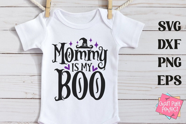 May include: White baby onesie with black text that reads "Mommy is my Boo" with a purple witch hat and stars above the text.