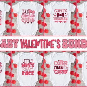 May include: A set of ten white baby onesies with pink Valentine's Day themed designs. The designs include phrases like "Lil' Valentine Cutie", "My Heart Belongs to Daddy", and "Cuter Than Cupid".