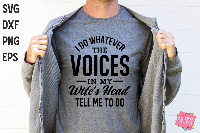 May include: A gray t-shirt with black text that reads "I do whatever the voices in my wife's head tell me to do".