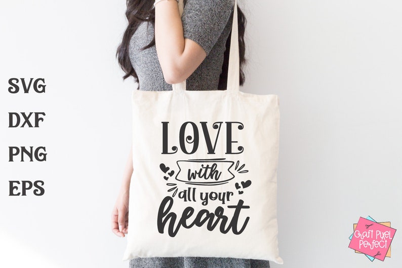 May include: A white tote bag with black text that reads "LOVE with all your heart". The text is in a decorative font with hearts and swirls around it.