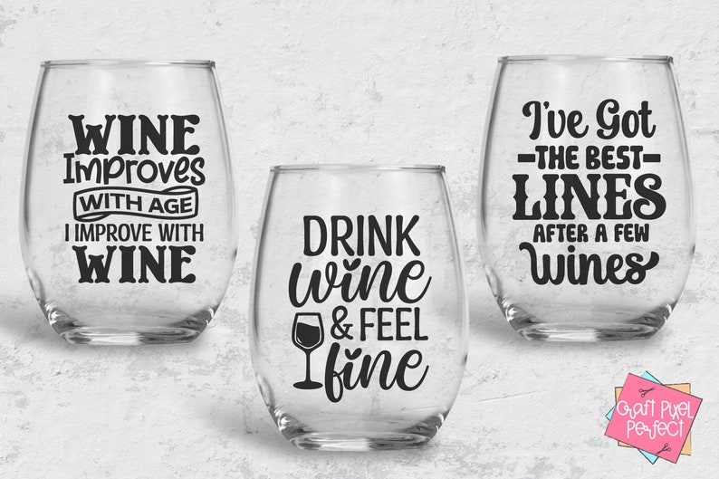 May include: Three clear wine glasses with black vinyl lettering. The first glass says "Wine Improves With Age I Improve With Wine". The second glass says "Drink Wine & Feel Fine". The third glass says "I've Got The Best Lines After A Few Wines".