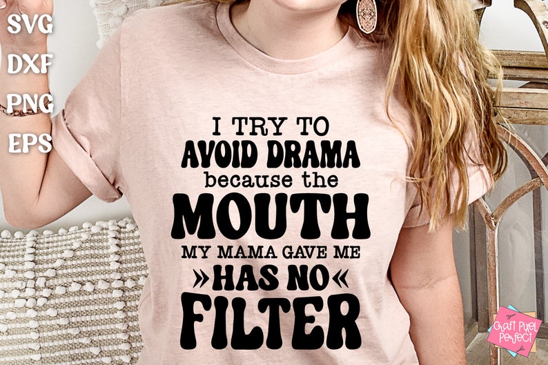 May include: A pink t-shirt with black text that reads "I try to avoid drama because the mouth my mama gave me >>has no<< filter".