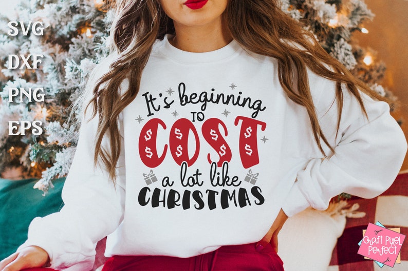 May include: White sweatshirt with a red and black graphic that says "It's beginning to cost a lot like Christmas".