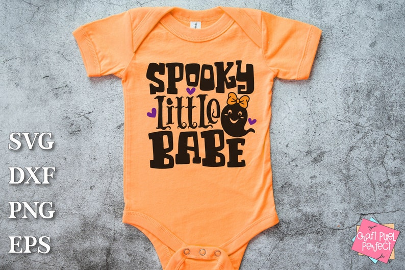 May include: Orange baby onesie with the text "Spooky Little Babe" in black with a ghost graphic and purple hearts.