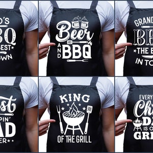 May include: Six different aprons with white text on a black background. The aprons feature various sayings related to grilling and barbecue, such as "Dad's BBQ", "Beer and BBQ", "Grandpa's BBQ", "Best Flipping' Dad", "King of the Grill", and "Everybody Chill Dad is on the Grill".
