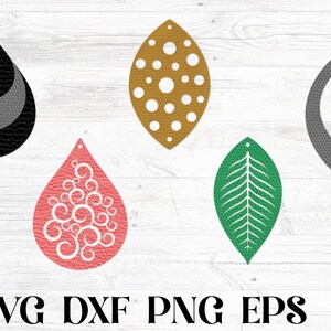 Pu&ograve; includere: Cinque diversi modelli di orecchini per l'artigianato. I modelli includono una forma a goccia nera e grigia, una goccia dorata con pois bianchi, una goccia grigia con un ritaglio ovale arrotondato, una goccia rosa con vortici bianchi e una forma di foglia verde.