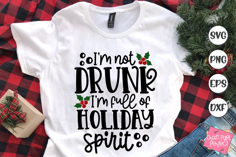 May include: White t-shirt with a black and green design that says "I'm not drunk I'm full of holiday spirit."
