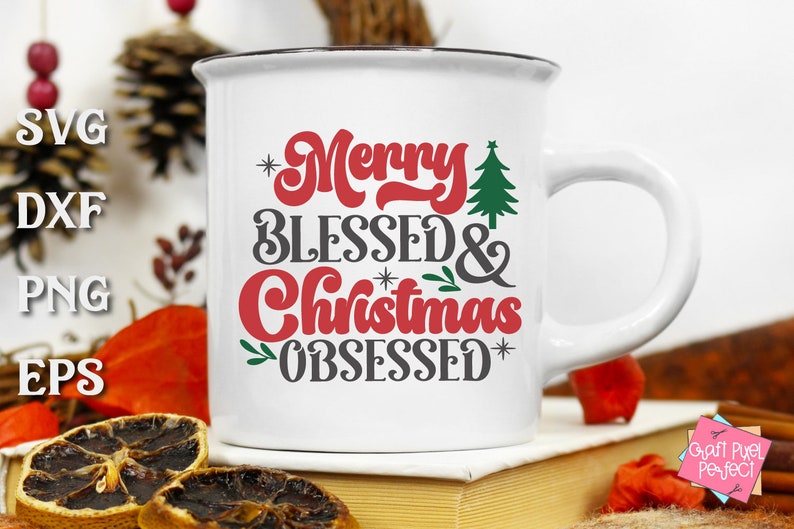 May include: White ceramic mug with a black rim and handle. The mug has a red and black design that says "Merry Blessed & Christmas Obsessed" with a small green Christmas tree graphic.