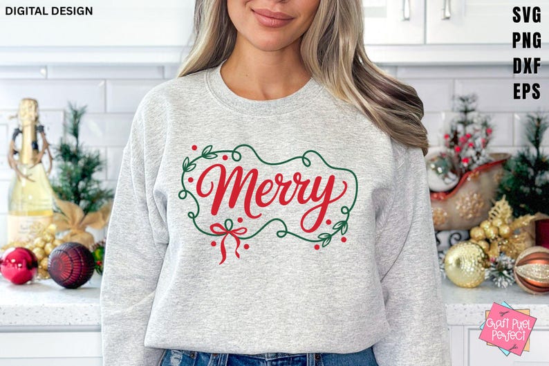 May include: A light gray sweatshirt with the word "Merry" in red script, framed by a green and red floral design. The sweatshirt is a digital design, perfect for the holiday season.