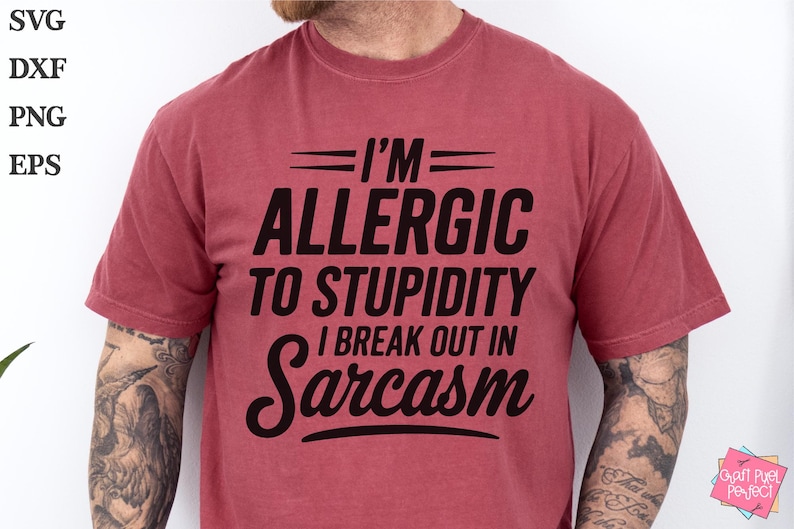 May include: A red t-shirt with the text "I'M ALLERGIC TO STUPIDITY I BREAK OUT IN Sarcasm" printed in black.