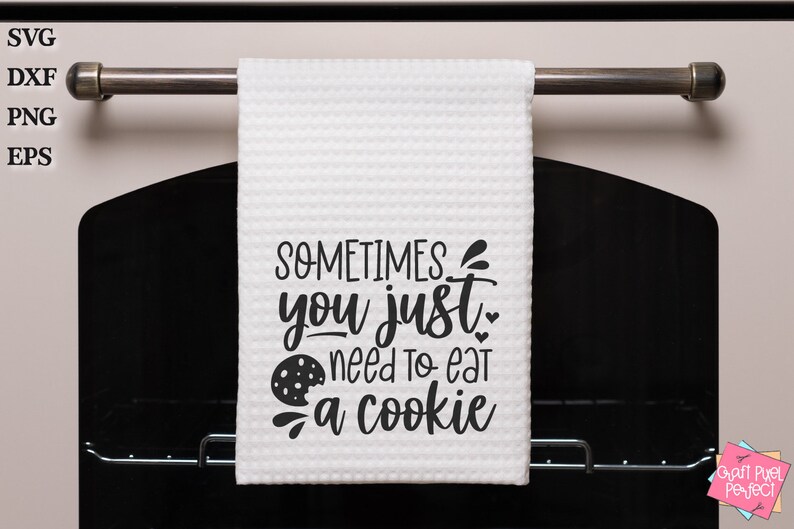 May include: A white kitchen towel with the text "SOMETIMES you just need to eat a cookie" in black lettering. A chocolate chip cookie graphic is included in the text.