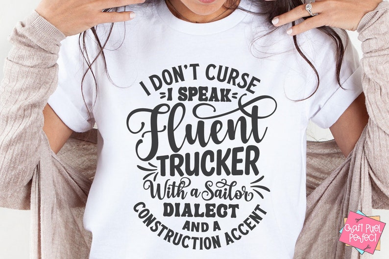 May include: White t-shirt with black text that reads "I don't curse = I speak - fluent trucker with a sailor dialect and a construction accent".