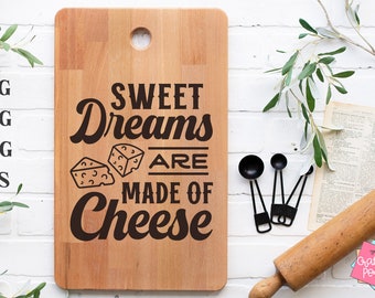 May include: A wooden cutting board with the text "Sweet Dreams Are Made Of Cheese" and a graphic of two slices of cheese.