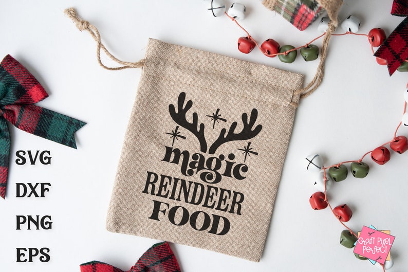 May include: A brown burlap gift bag with the text "magic reindeer food" in black lettering. The bag has a drawstring closure and is decorated with a black silhouette of reindeer antlers.