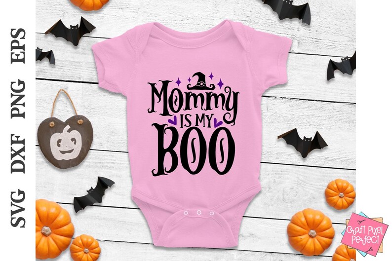 May include: Pink baby onesie with a black and purple graphic that says "Mommy is my Boo" with a witch's hat on top of the "O".