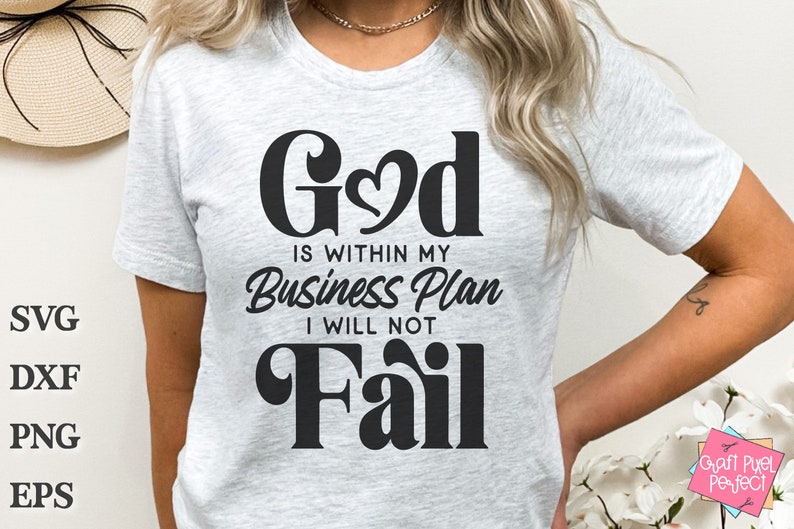 May include: A white t-shirt with black text that reads "God is within my Business Plan I will not Fail".