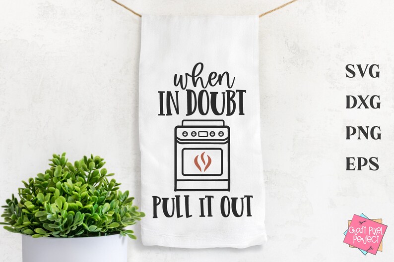 May include: White kitchen towel with black text that reads "When in doubt, pull it out."  A black and white illustration of a stove with a red flame is above the text.