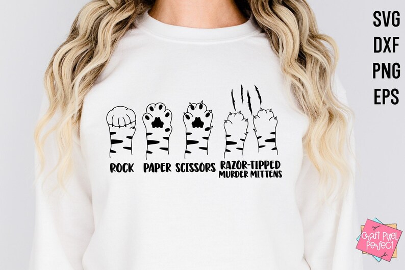 May include: White sweatshirt with a black graphic of cat paws and the text "Rock Paper Scissors Razor-Tipped Murder Mittens".