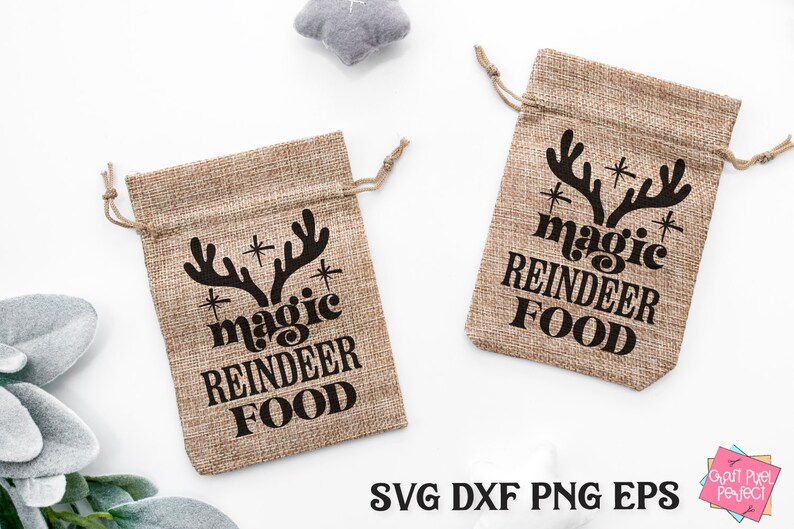 May include: Two brown burlap gift bags with black text and reindeer antlers. The text on the bags reads "* magic reindeer food *"