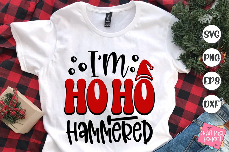 May include: White t-shirt with black text that reads "I'm Ho Ho Hammered" with a red Santa hat graphic.