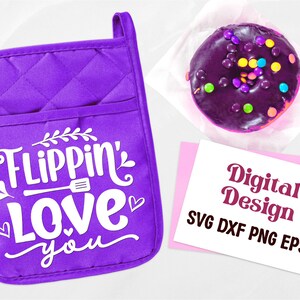 May include: A purple quilted oven mitt with the text "Flippin' Love You" in white. A glazed donut with colorful sprinkles sits on a white paper. A pink card with the words "Digital Design" is also present.